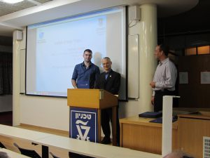 Ivan Zaporozhets receiving diploma from Prof. Oshman