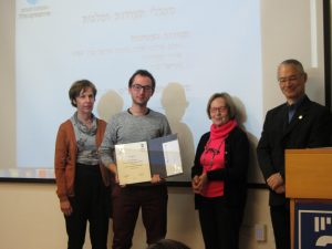 Maxim Feidin receiving scholarship from the Zohar family