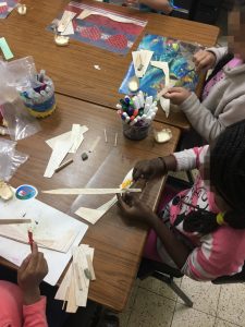 Assembling and decorating airplane models at the “Imbar” after-school child care facility