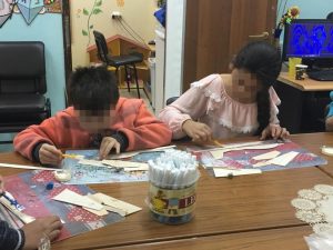 Decorating airplane models at the “Imbar” after-school child care facility